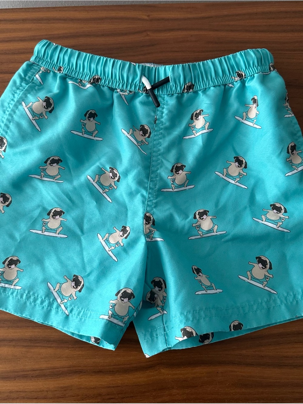 Kids Turquoise Pug Surf Print Swim Trunks